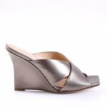 Metallic taupe wedge sandal with two crossed leather straps over the toes and a low, curved wedge heel.