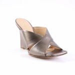 Metallic silver wedge sandal with crisscross straps and open toe on a white background.