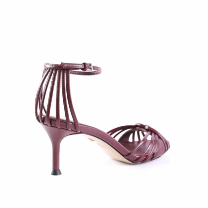 Burgundy strappy high-heeled sandal with an ankle buckle, on a white background.
