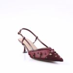 Maroon pointed-toe high-heeled slingback with studded embellishments along the toe box.