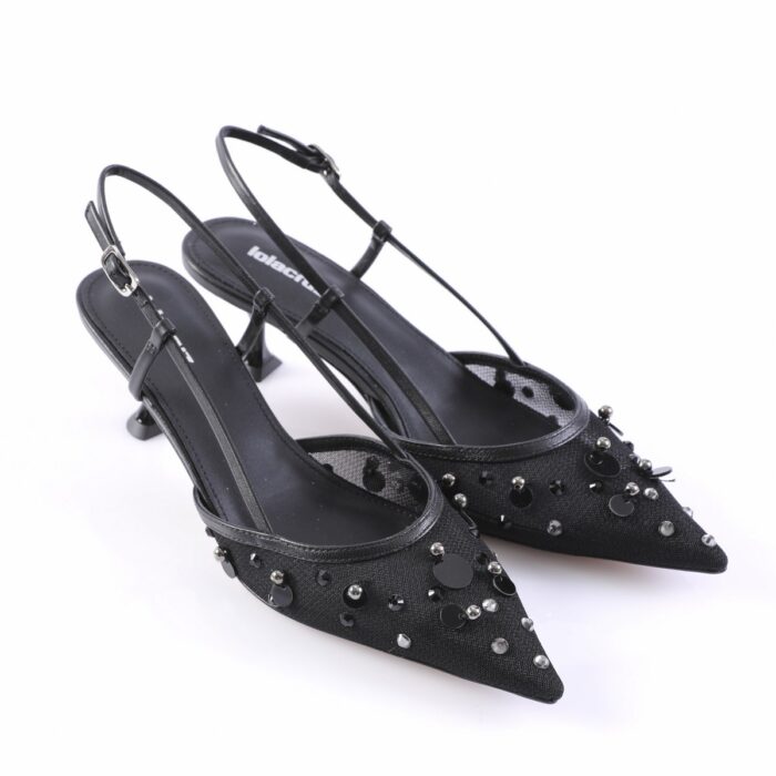 Black pointed-toe slingback heels with decorative studs and beads on a white background