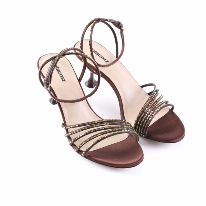 Brown suede strappy heeled sandals with gold-toned studs and an ankle buckle, open-toe design on white background