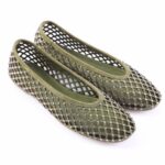 Olive green mesh ballet flats adorned with small silver studs on a white background, open lattice design.