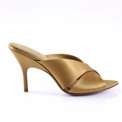 Gold satin heeled mule with crisscross straps and an open toe, mid-height stiletto heel.]
