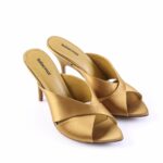 Gold satin high-heeled sandals with crisscross wide straps and an open toe.