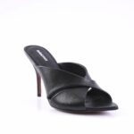 Black leather high-heeled mule sandal with crisscross straps and stiletto heel, front view on white background
