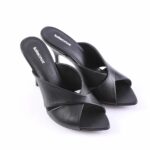 Black open-toe slip-on heeled sandals with cross-fold straps on a white background, kitten-heel pair
