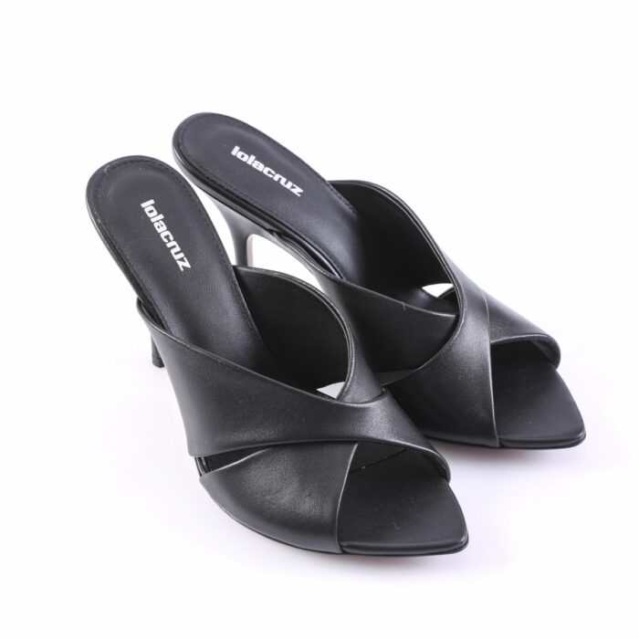 Black open-toe slip-on heeled sandals with cross-fold straps on a white background, kitten-heel pair