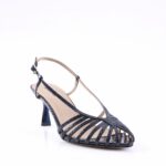 Navy patent strappy sandal with a mid-height, curved heel and beige ankle strap