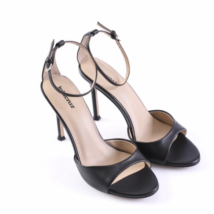 Black open-toe high-heeled sandals with thin ankle straps and stiletto heels, shown from a front-side angle.