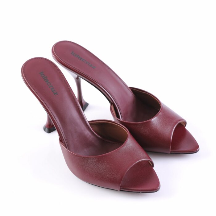 Pair of burgundy leather, open-toe high-heeled mules on a white background, showcasing a sleek silhouette.