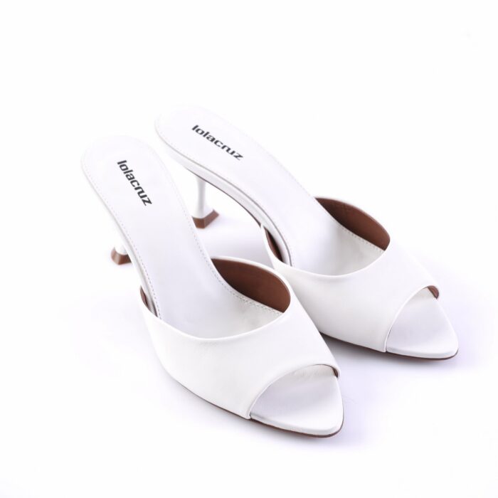 White open-toe heeled mules with mid-height heels and Lola Cruz insoles (brand visible).