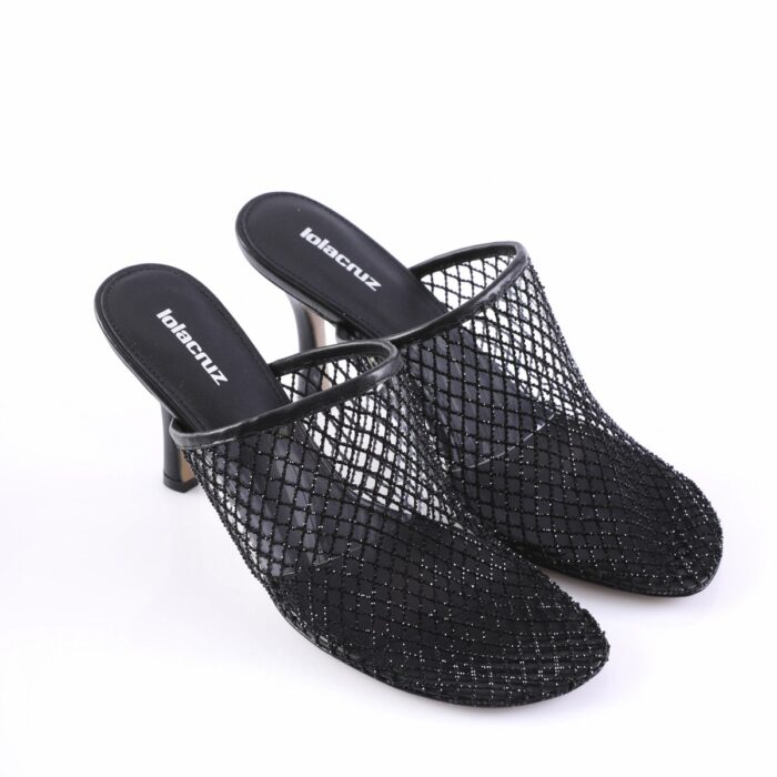 Black mesh slip-on heeled mules with a netted upper on a white background, showing short block heels and brand-inscribed insoles