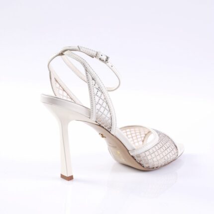White strappy high-heel sandal with rhinestone mesh panels and ankle buckle (side view).
