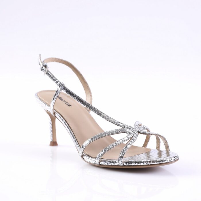 Silver glittery open-toe high-heeled sandal with multiple thin straps and an ankle buckle; stiletto heel.