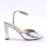 Silver snakeskin-texture high-heeled sandal with ankle strap and block heel, open toe look.