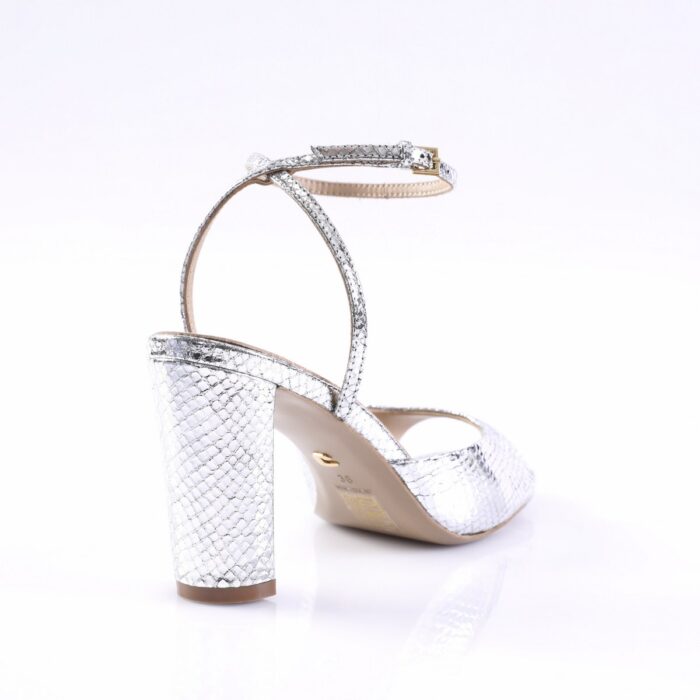 Silver snakeskin-pattern high-heeled sandal with an ankle strap and chunky block heel.