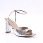 Silver metallic open-toe sandal with a textured pattern, chunky block heel, and adjustable ankle strap.