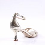 Silver snakeskin-embossed high-heeled sandal with a slim ankle strap and pointed heel details.