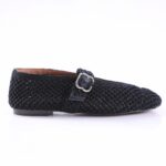 Black woven loafer with a silver buckle strap on a white background, side view showing low heel and open lattice weave