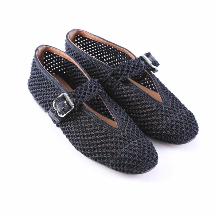 Pair of navy blue knitted Mary Jane flats with buckle straps and tan inner lining