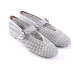 Silver mesh Mary Jane shoes with a buckle strap on a white background, sparkling finish
