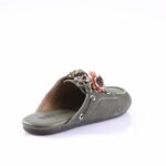 Olive suede slip-on sandal with a decorative fabric flower and braided lace detail on the strap, open back edge visible.