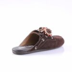 Brown suede mule/slip-on sandal with a braided fabric flower on the vamp against a white background.