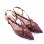 Pair of burgundy leather pointed-toe slingback heels with crossed straps and a low heel