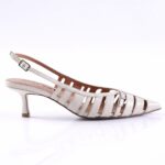 White strappy slingback sandal with a low kitten heel and multiple vertical straps, buckle closure at the ankle.
