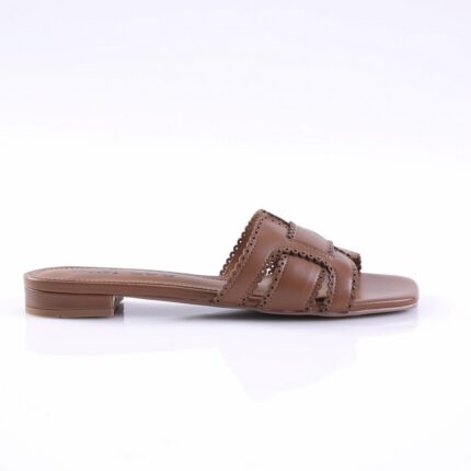 Brown leather slide sandal with two braided straps and decorative perforated scalloped edges, low block heel, side view