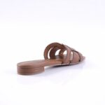 Brown flat slide sandal with braided strap detail on a white background (product photo)