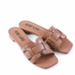 Brown leather slide sandals with scalloped perforated trim and low block heel; insole reads 'BIBI LOU'.