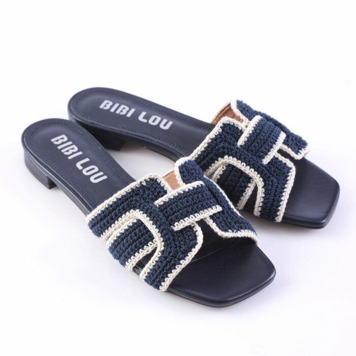 Navy blue woven slide sandals with cream trim and the brand BIBI LOU on the insole.