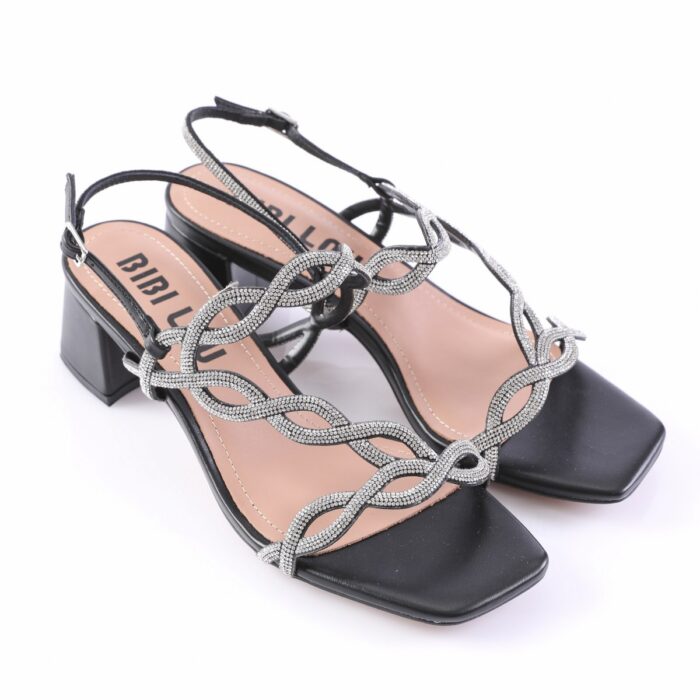 Black open-toe sandals with a chunky low heel and silver rhinestone-embellished interwoven straps across the top and around the ankle buckle