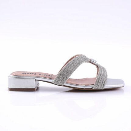 Silver women's sandal with a low block heel and glittery braided straps, revealing a soft pink insole and metallic sole detail.