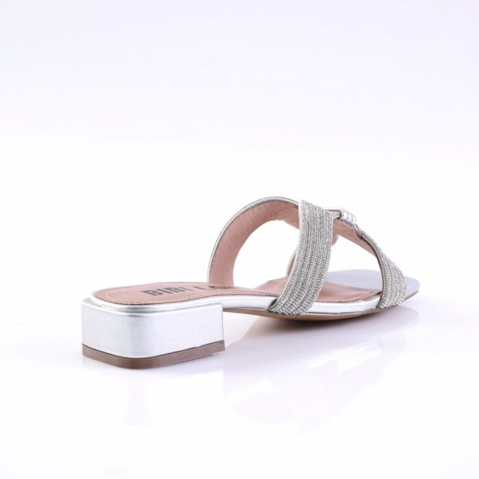 Silver sandal with rhinestone-studded straps and a low metallic block heel, viewed from the side.