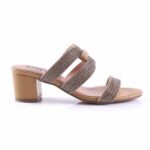 Beige heeled sandal with two sparkly, rhinestone-embellished straps and a block heel.