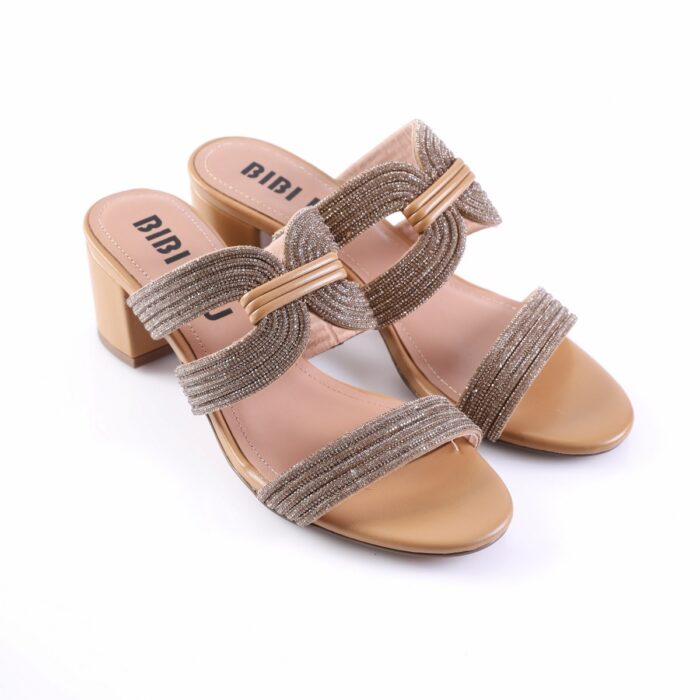 Beige open-toe heeled sandals with multi-strand glittery straps and a chunky block heel. Two wide sparkling straps cross over the foot with a central beige band holding them together.