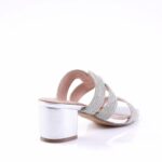 Open-toe silver sandal with three rhinestone-embellished straps and a low block heel on a white background, viewed from the side/back