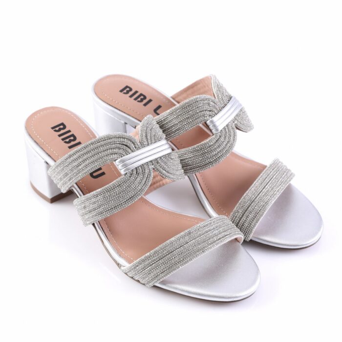 Silver glitter sandals with braided straps and low block heel, labeled BIBI LUX on the insole start side.