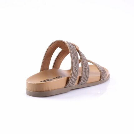Beige flat sandal with two glittery straps across the foot and a tan sole (open-toe slide).