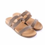 Tan slide sandals with multiple glittery beige straps and a knotted center.