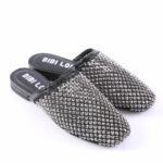 Black slip-on mules covered in silver rhinestones with a cushioned insole that reads 'BIBI LOU'.
