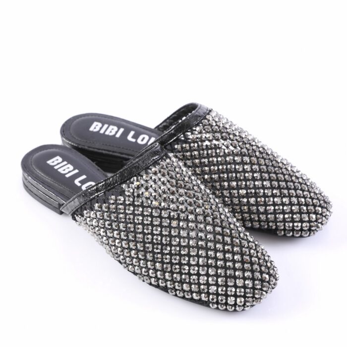Black slip-on mules covered in silver rhinestones with a cushioned insole that reads 'BIBI LOU'.