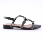 Black strappy flat sandal with glittery, knotted straps and a low heel on a neutral sole – stylish summer footwear