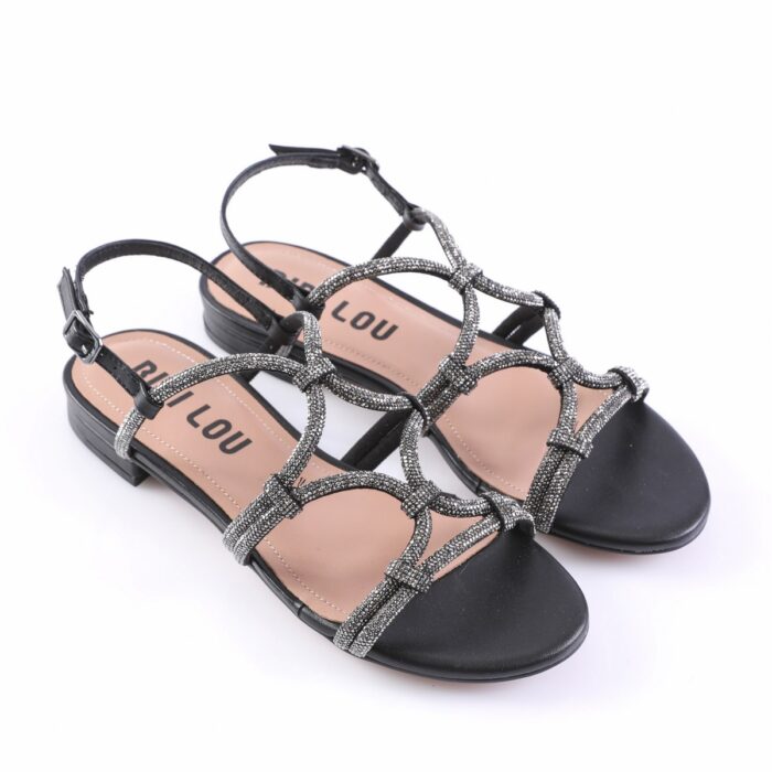 Black strappy sandals with glittery silver straps, open toe, and low heel with an ankle buckle, stylish and dressy.