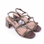Brown strappy heeled sandals with glittery straps and a chunky block heel, open toe design, viewed from above.