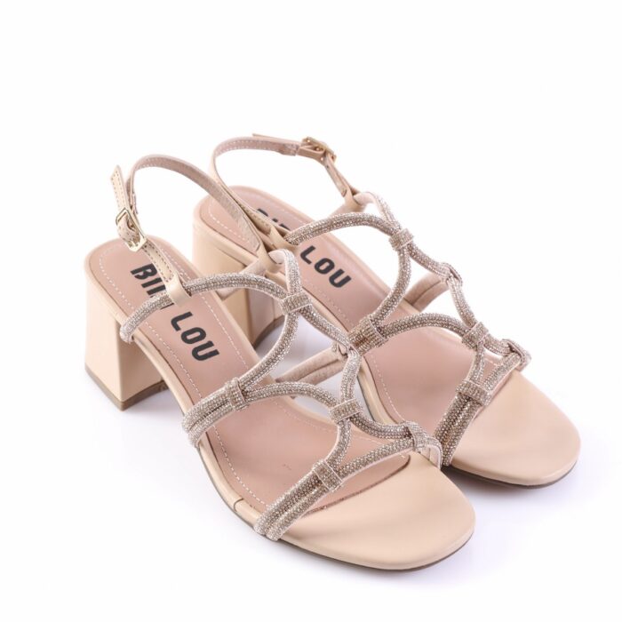 Beige strappy heeled sandals with glittery interwoven straps and a chunky block heel.
