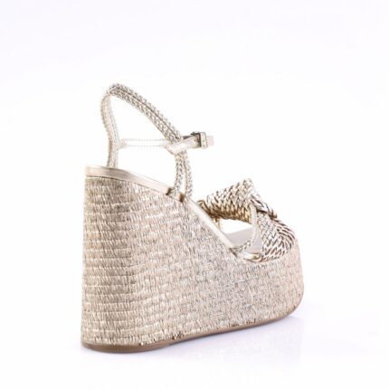 Gold-tone woven wedge sandal with braided straps, side view.